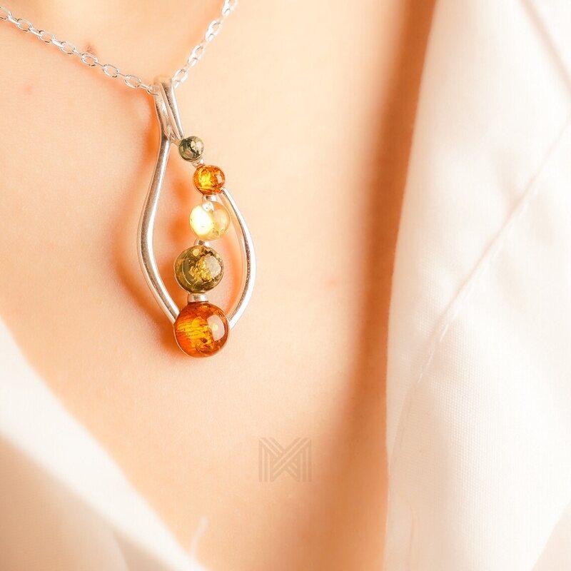 MILLENNE Multifaceted Baltic Amber Curved Oval Silver Pendant with 925 Sterling Silver